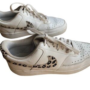 Nike low top white with leopard printo logo size 7.5